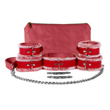 a set of red leather cuffs and cuffs with chains