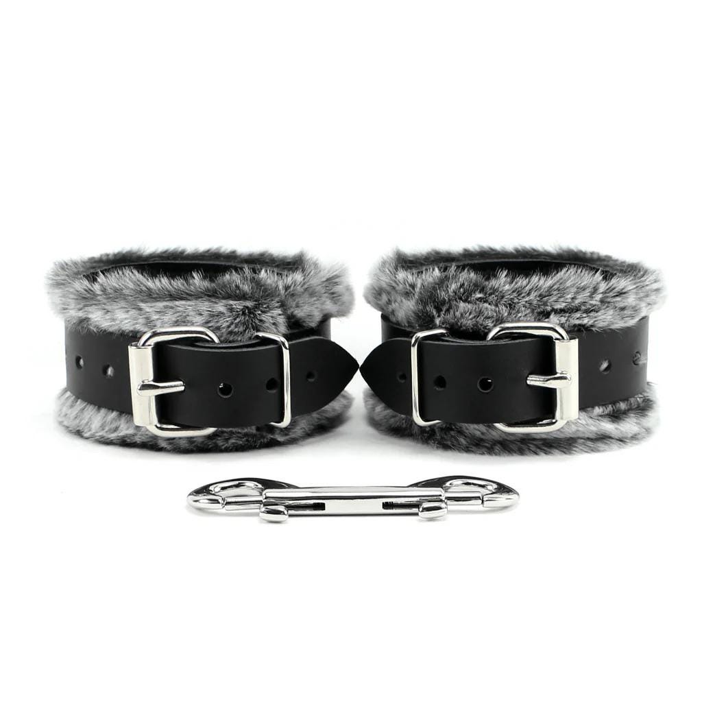 a pair of cuffs with fur on them