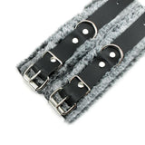 a pair of black leather belts with metal buckles