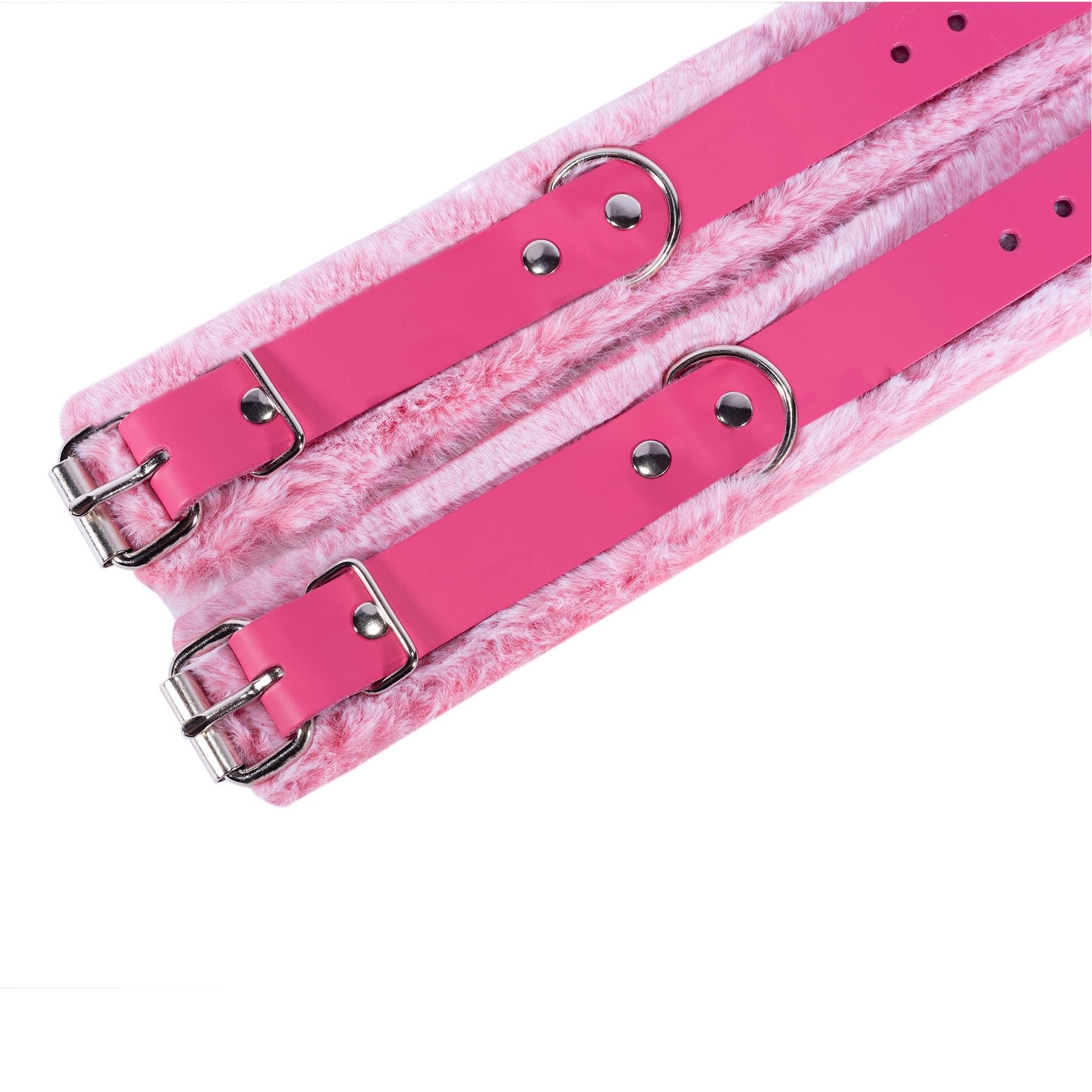 a pair of pink leashes with metal rings