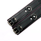 Padded leather bdsm cuffs purple detail