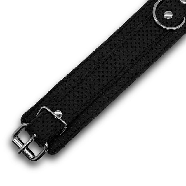 Black perforated leather bondage collar detail