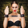 Red padded leather BDSM cuffs on model